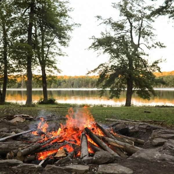 Glowing campfire by the lake
