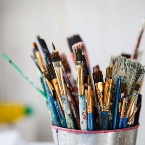 Close up of art brushes in a pot