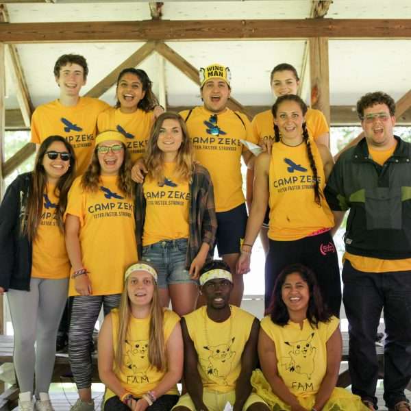 Group of Camp Zeke staff all in yellow camp shirts