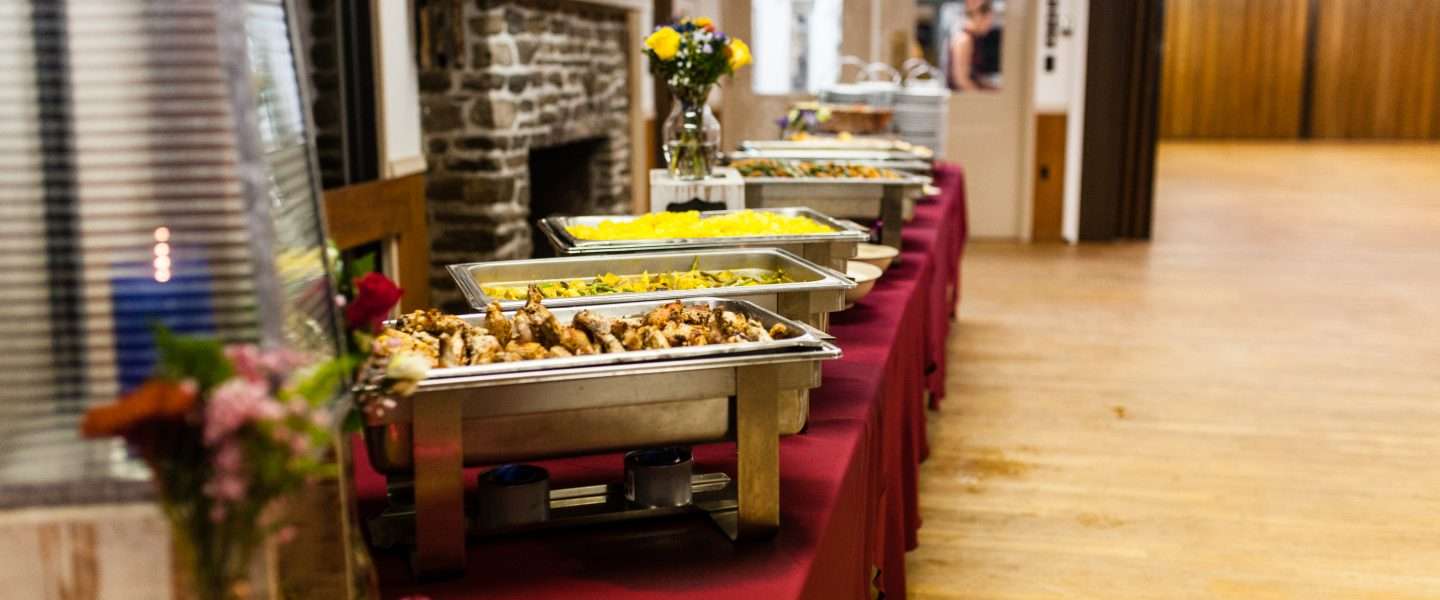 Long table full of freshly prepared food ready for a banquet