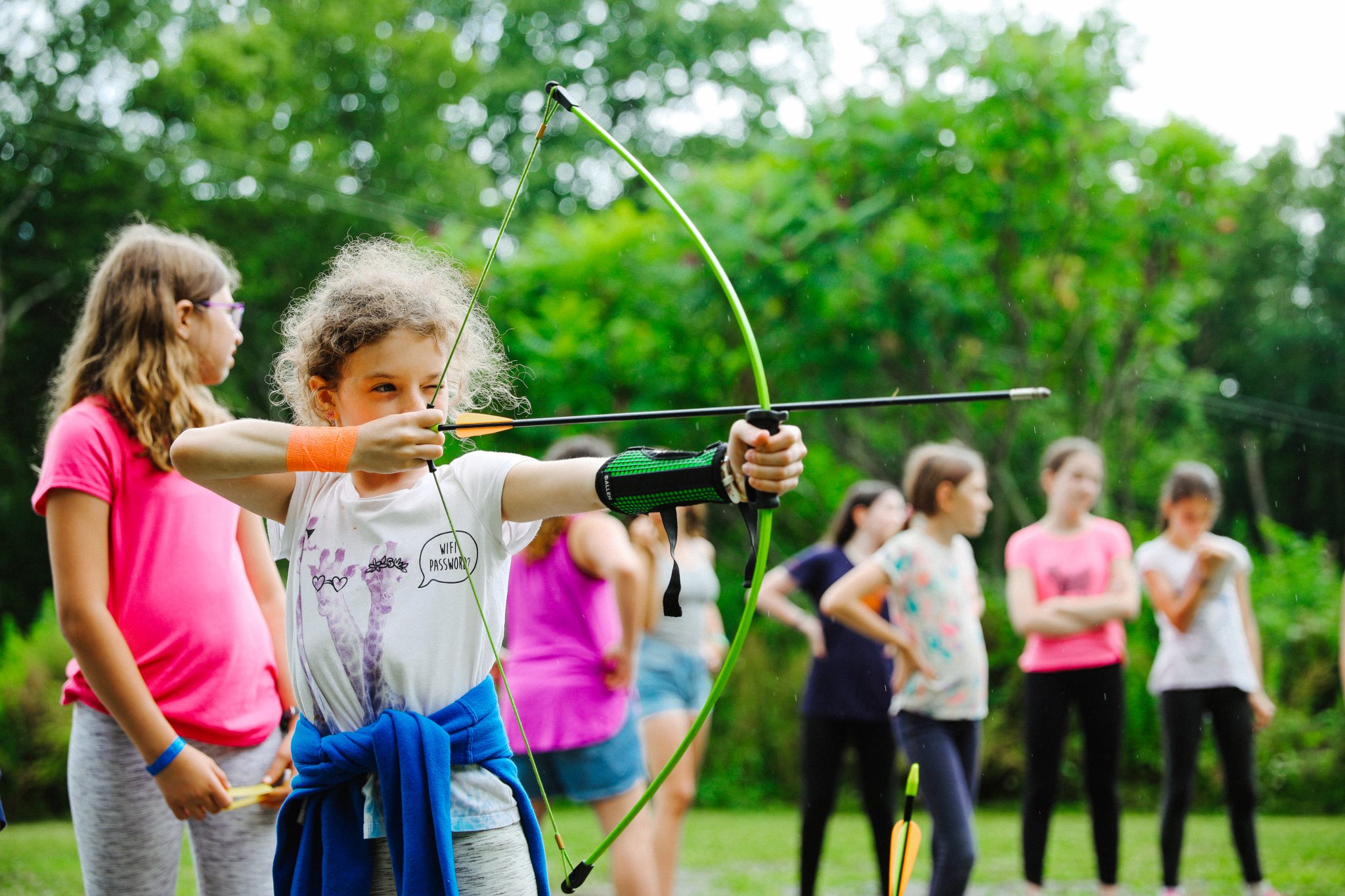 Young girl doing archery